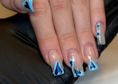 Elegant blue nail art design at Lvy Luxe Nails in Swindon, England, GB showcases creative craftsmanship.