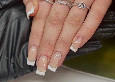 Stylish French manicure at Lvy Luxe Nails, Swindon, England, GB showcasing pristine white tips.