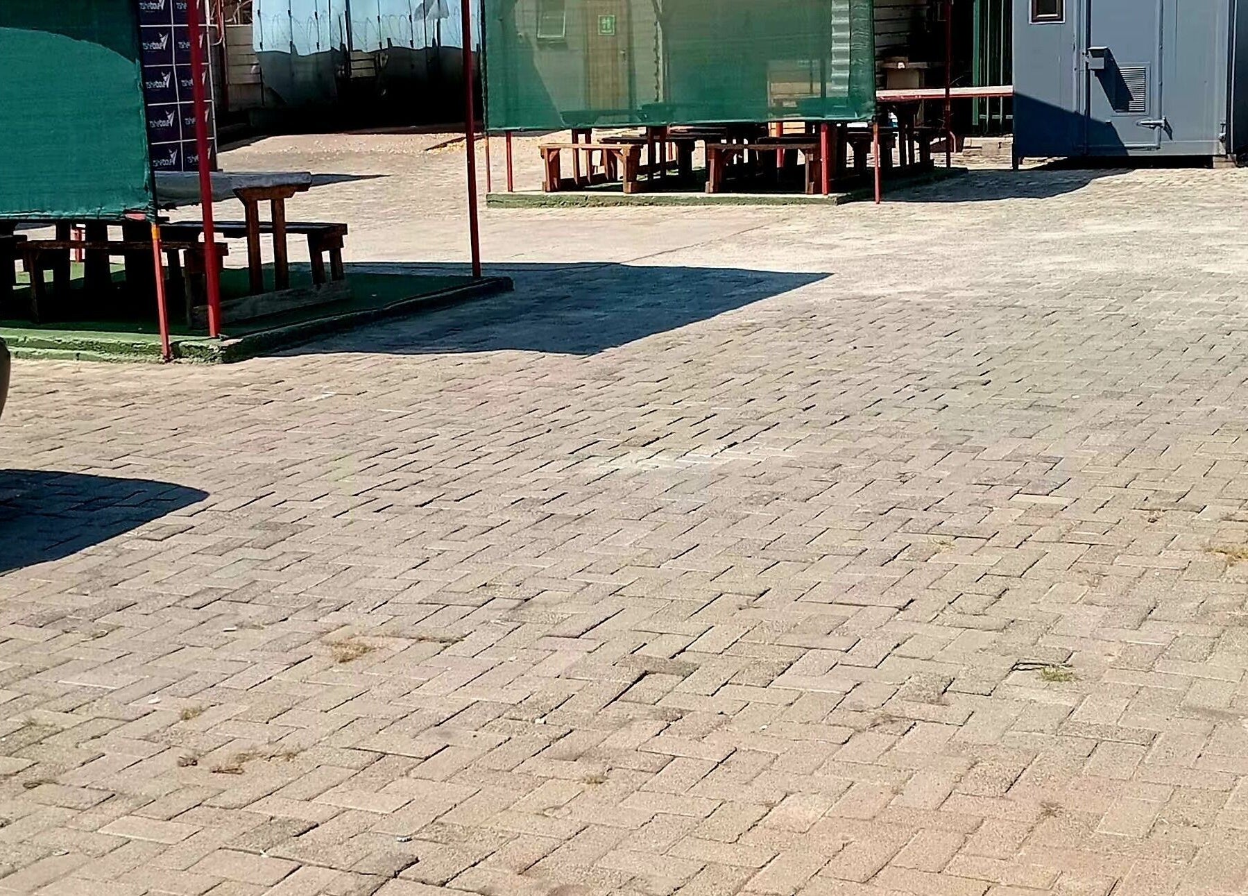 Spacious outdoor area at Polished_by_mini, Rustenburg, North West, ZA. Paved, sunlit space for relaxation.