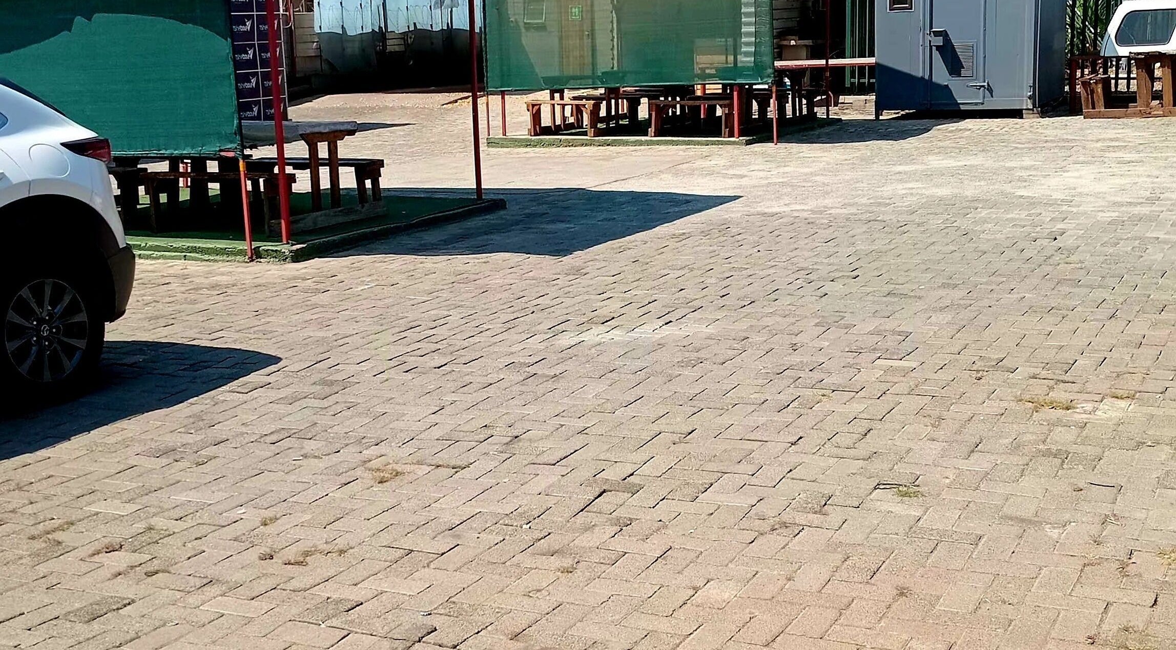 Spacious outdoor area at Polished_by_mini, Rustenburg, North West, ZA. Paved, sunlit space for relaxation.