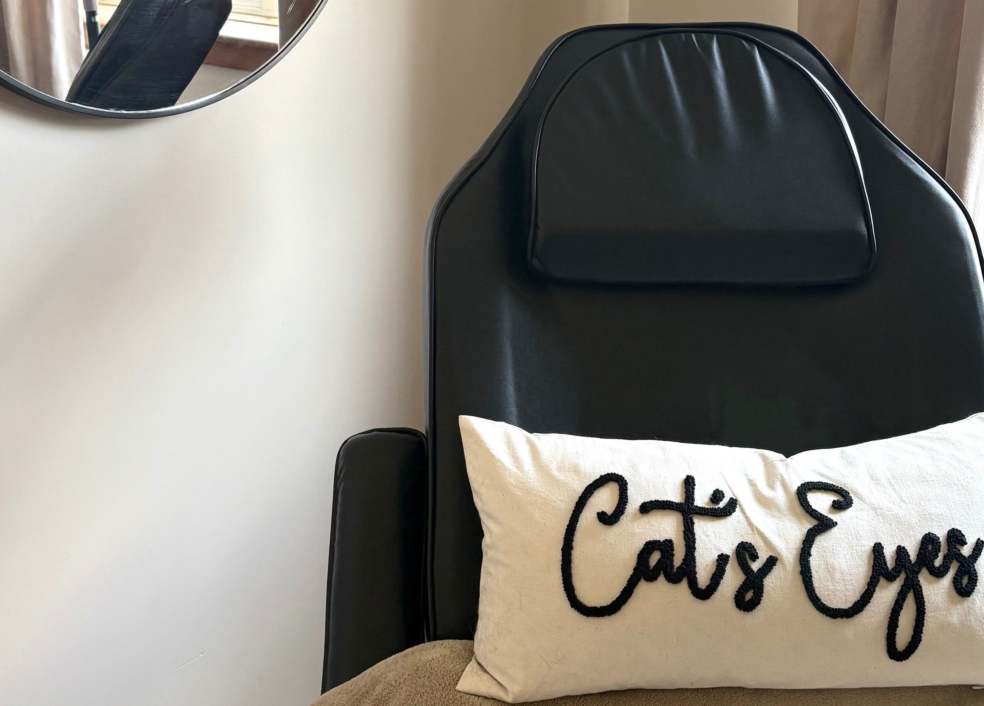 Relaxation chair with Cat's Eyes pillow at Cat’s Eyes, Kilbarchan, Scotland, GB.