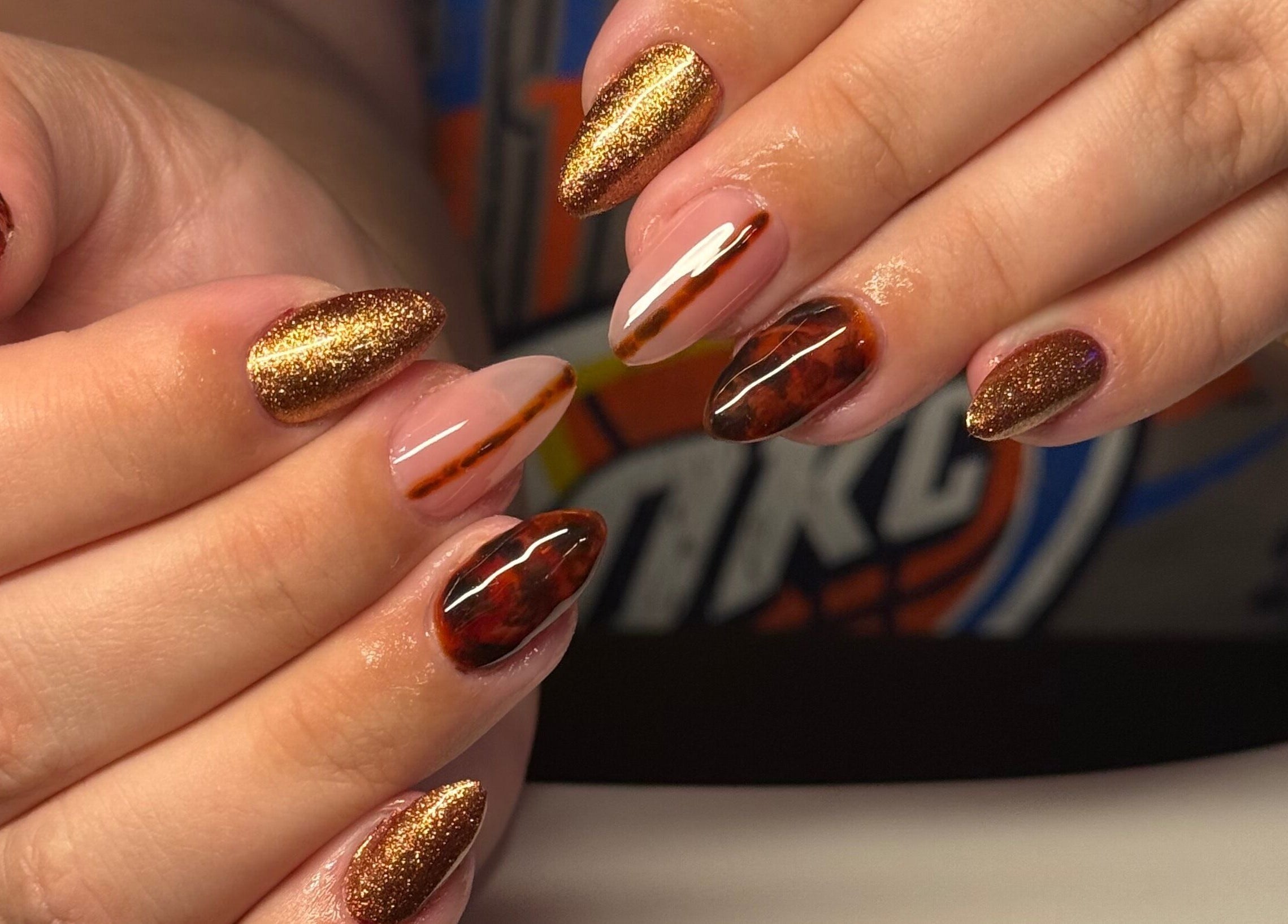 Elegant brown and gold nail art at Opal & Claws, Hurst, Texas, US.