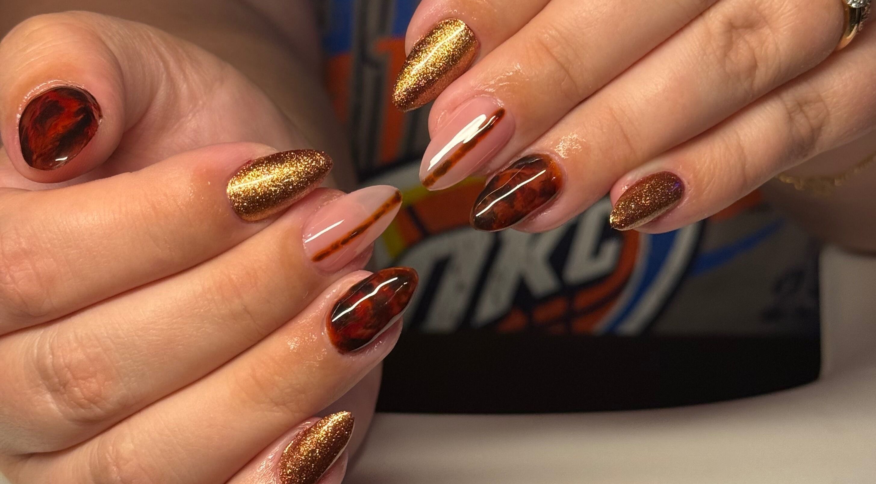Elegant brown and gold nail art at Opal & Claws, Hurst, Texas, US.