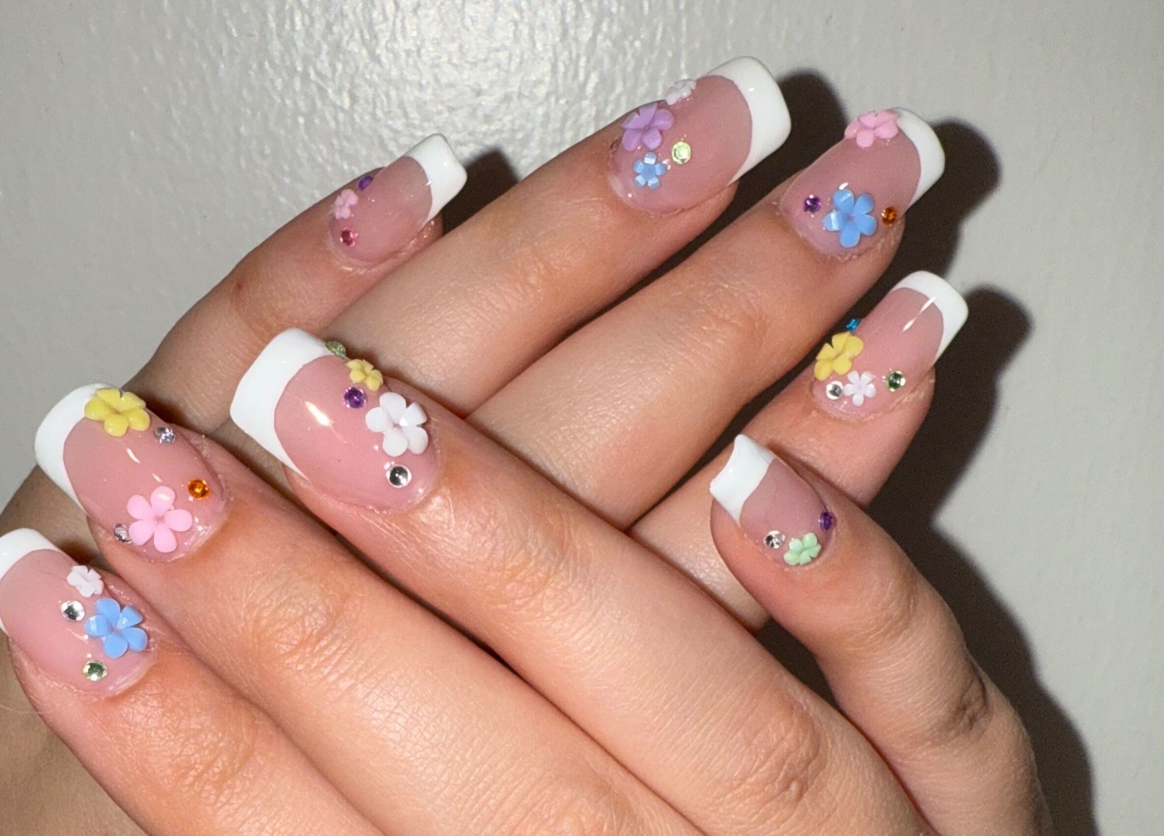 Elegant floral French manicure at Opal & Claws, Hurst, Texas, US showcasing intricate nail art.