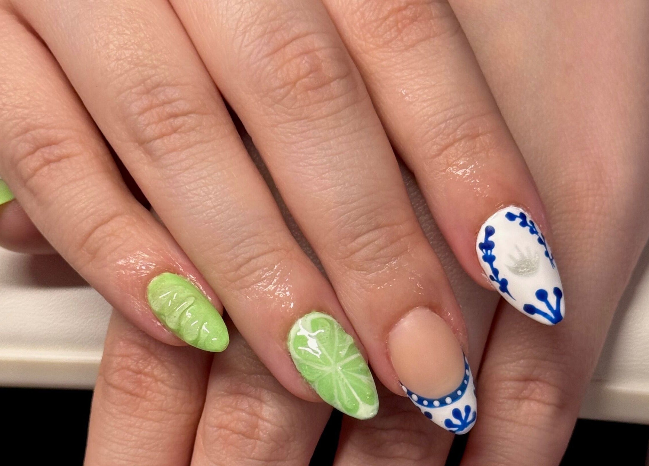 Artistic nail design with green and blue accents at Opal & Claws, Hurst, Texas, US.