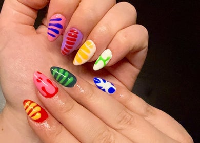 Colorful nail art design at Opal & Claws, Hurst, Texas, US showcasing vibrant patterns.