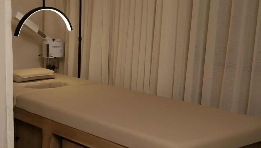 Tranquil massage room at 8 Infiito Salon, Jeddah, Makkah Province, SA, with cozy ambiance and modern design.