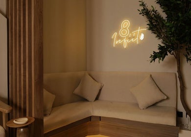 Relaxing seating area at 8 Infiito Salon, Jeddah, Makkah Province, SA, featuring stylish decor and ambience.