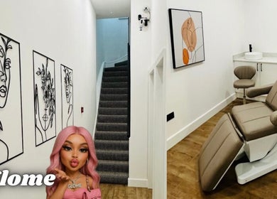 Elegant beauty treatment room at GLOME, London, England, GB featuring modern art and plush chair.