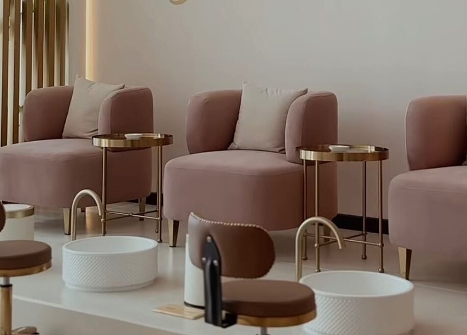 Chic pedicure lounge at Glowing Beauty & Spa, Al Athaiba, Muscat Governorate, OM, featuring plush seating.