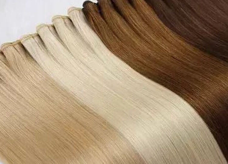Variety of hair extensions at DivaDazzle Hair Extensions, Denton, England, GB. Premium quality shades on display.