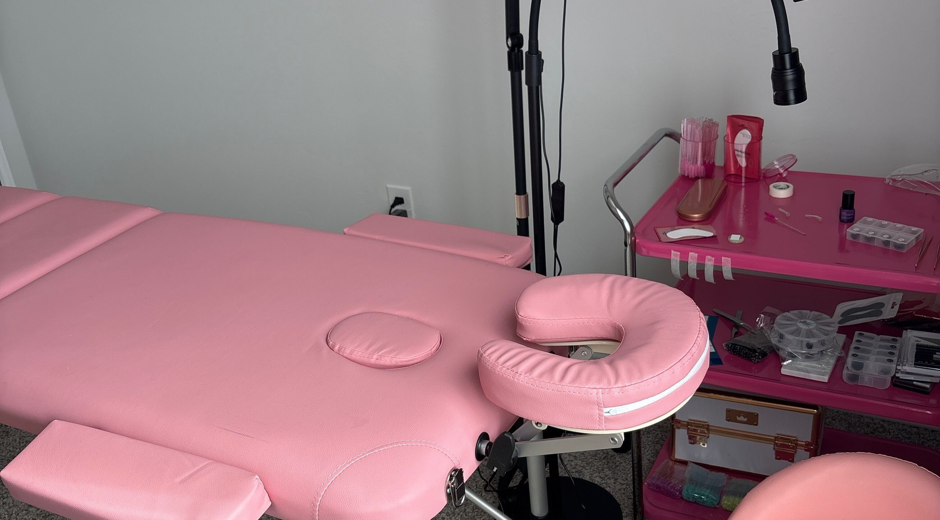 Cozy pink treatment bed at Britlyn Begley, Shawnee, Oklahoma, US, ready for beauty services.