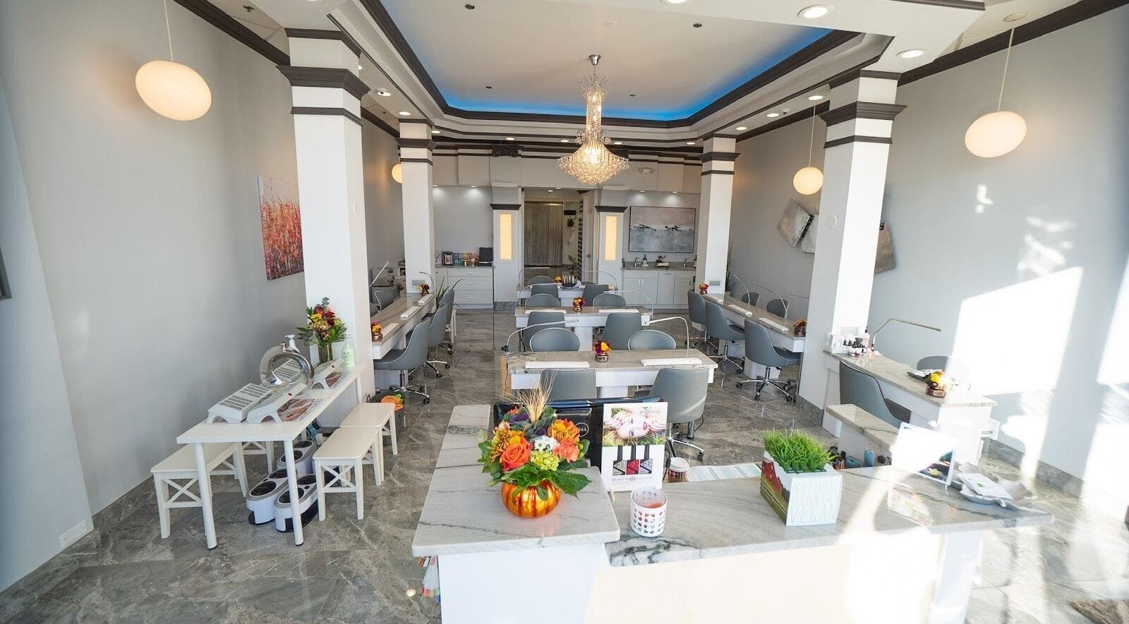 Spacious, chic interior of Organic Nails And Spa in Fairfax, VA, US, featuring stylish manicure stations.