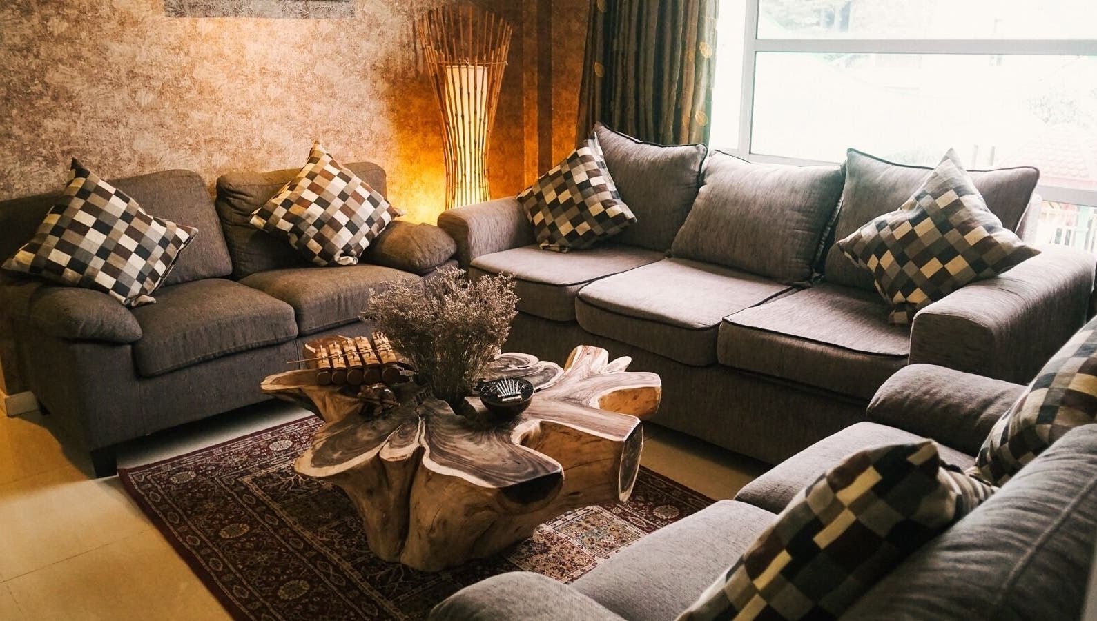 Elegant lounge area with sofas at Spa Central Batam, Kepulauan Riau, ID, offering a relaxing atmosphere.