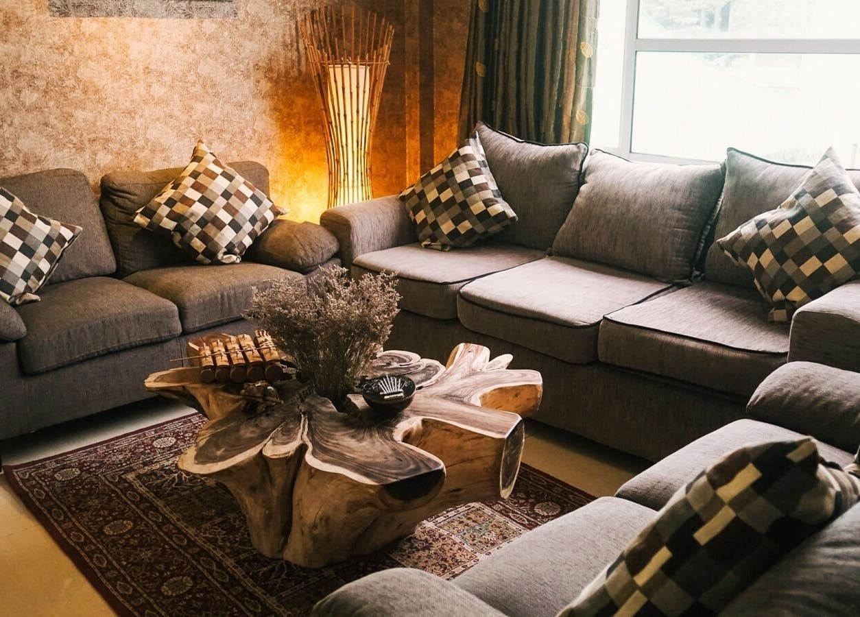 Elegant lounge area with sofas at Spa Central Batam, Kepulauan Riau, ID, offering a relaxing atmosphere.