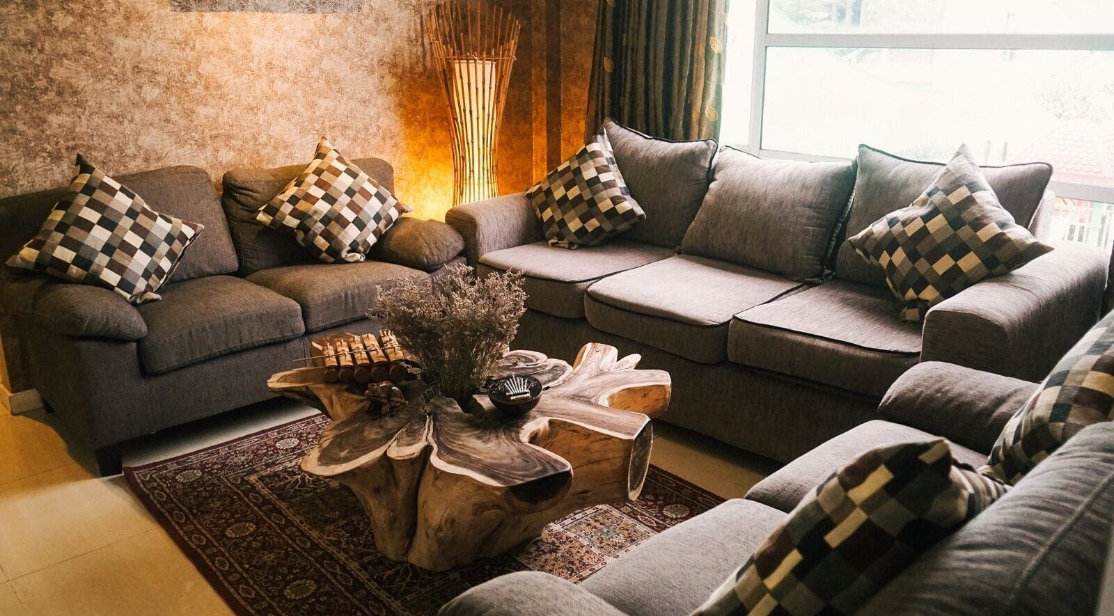 Elegant lounge area with sofas at Spa Central Batam, Kepulauan Riau, ID, offering a relaxing atmosphere.