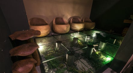 Relaxing lounge area with earthy chairs at Spa Central Nagoya, Kepulauan Riau, Kepulauan Riau, ID.