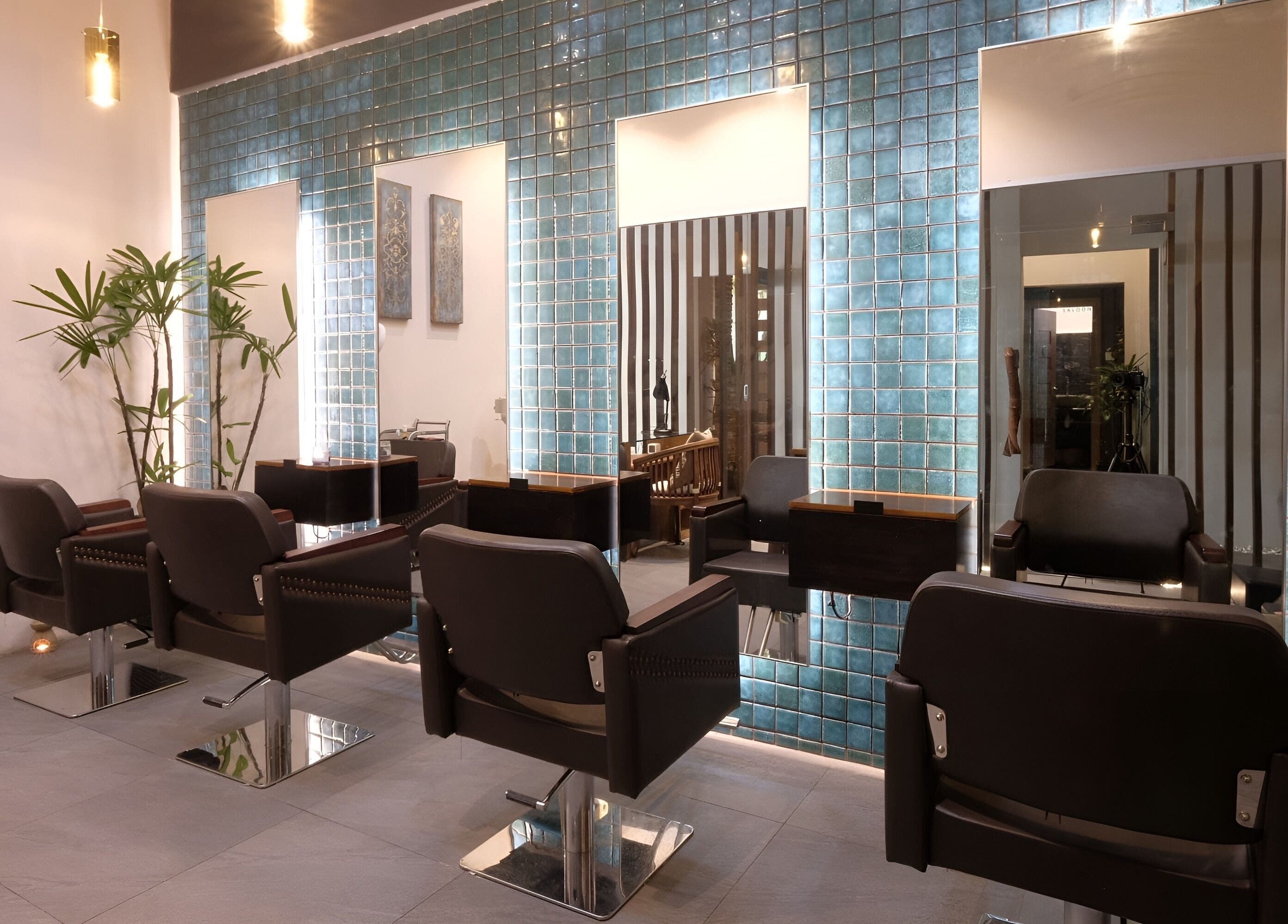 Elegant salon interior at Spa Central Nagoya in Kepulauan Riau, featuring modern styling chairs and sleek decor.