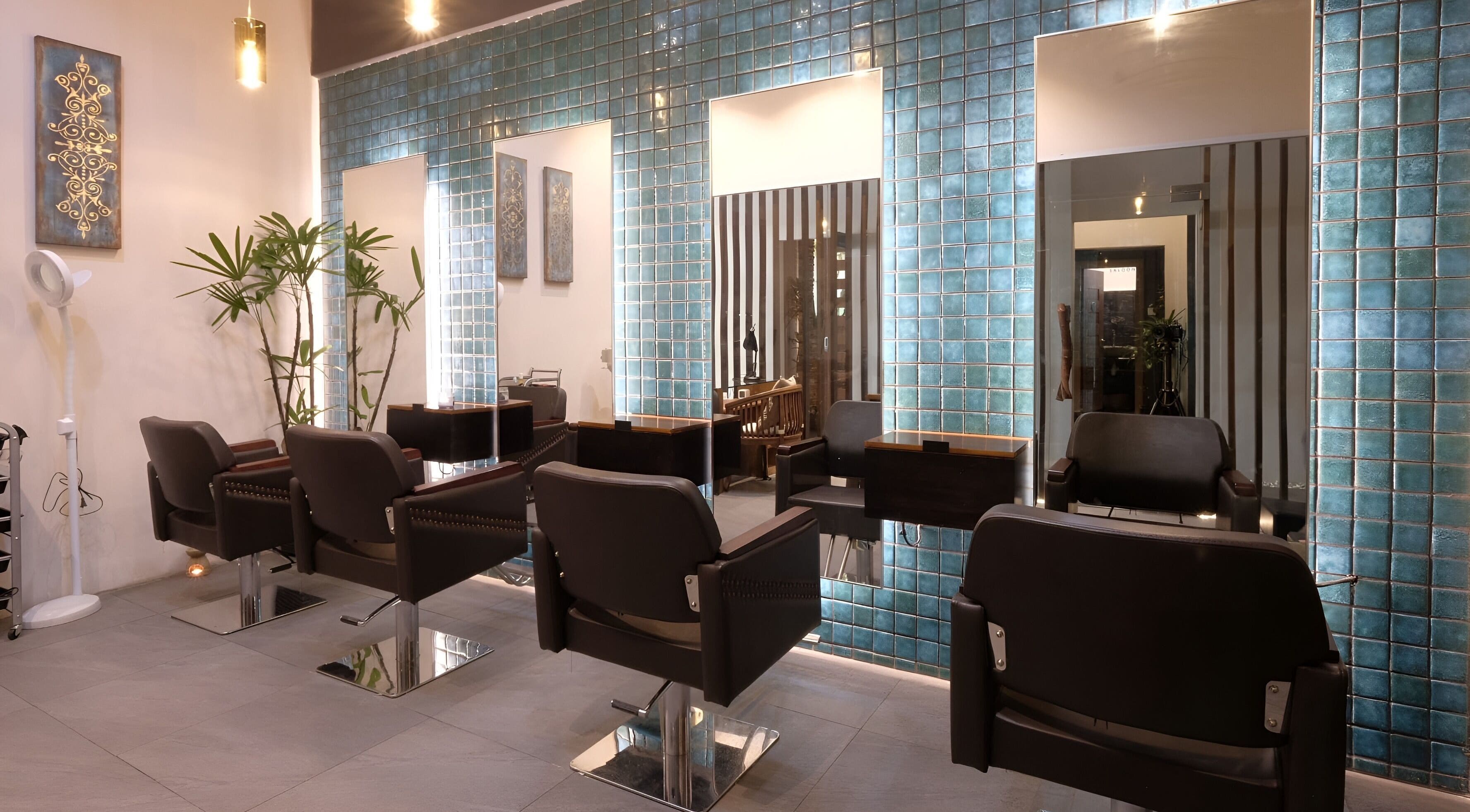 Elegant salon interior at Spa Central Nagoya in Kepulauan Riau, featuring modern styling chairs and sleek decor.