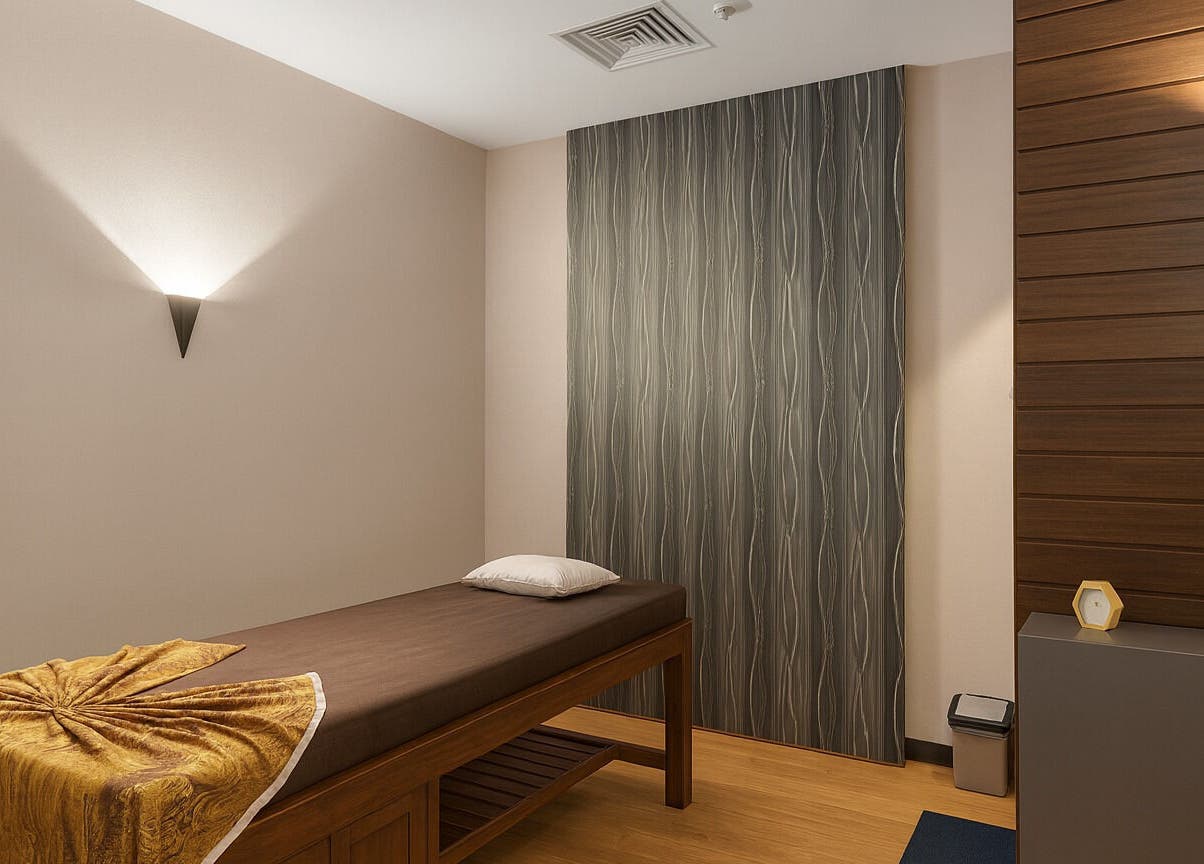 Relaxing massage room at Spa Central I Hotel Baloi, Kepulauan Riau, ID, featuring a serene ambiance.
