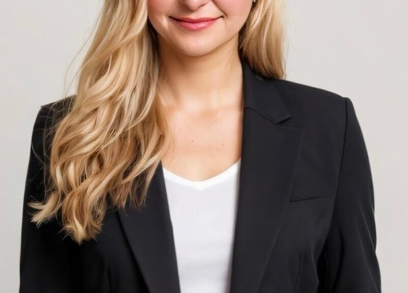 Professional woman with blonde hair at Hairport salon in Bushey, England, GB.