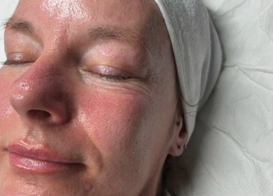 Relaxed individual enjoying facial treatment at Your Skin Club, Wakefield, England, GB, with glowing skin.