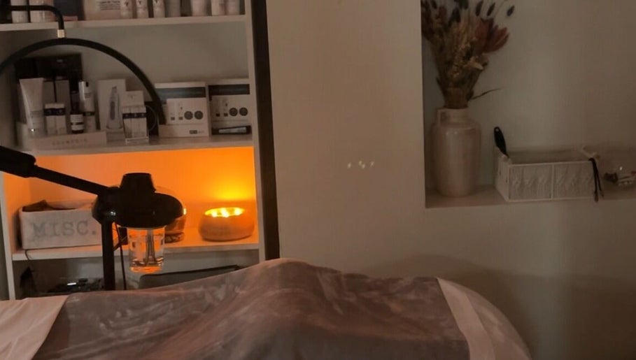 Relaxing spa room at Esthetician Chicago, illuminated by soft candlelight, in Chicago, Illinois, US.