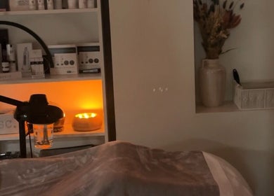 Relaxing spa room at Esthetician Chicago, illuminated by soft candlelight, in Chicago, Illinois, US.