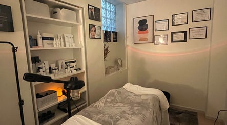 Tranquil treatment room at Esthetician Chicago, Chicago, Illinois, US with skincare products and certificates.