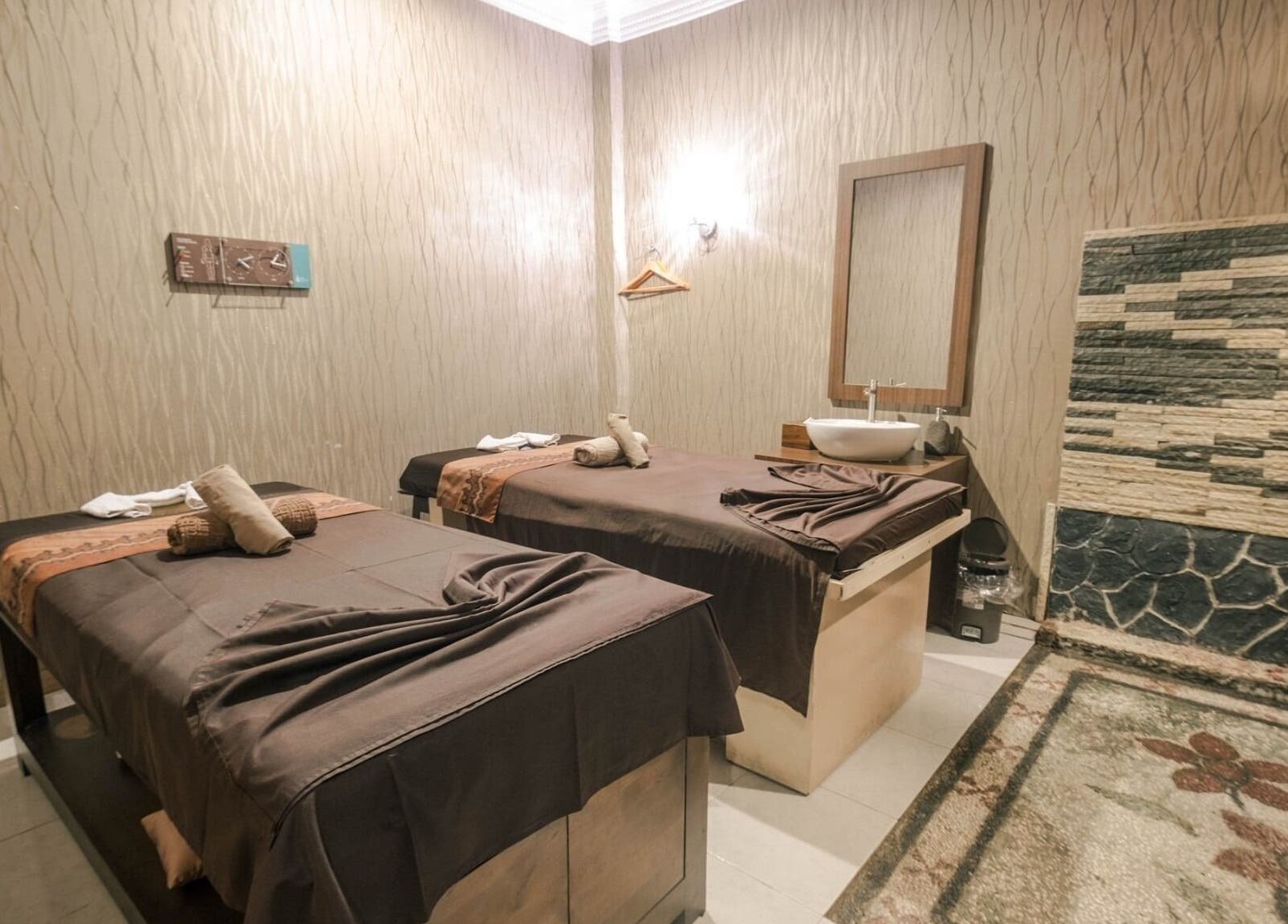 Elegant massage room with two tables at Massage Central, Kepulauan Riau, Kepulauan Riau, ID, offering tranquility.