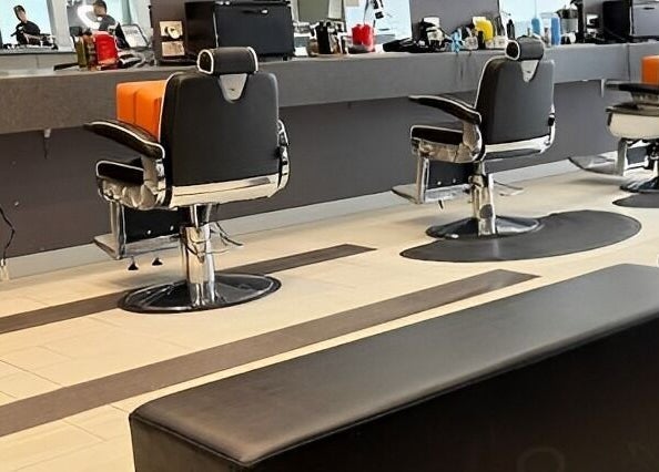 Modern salon chairs and mirrors at Goats Cuts, Southport, Queensland, AU, offering a stylish ambiance.