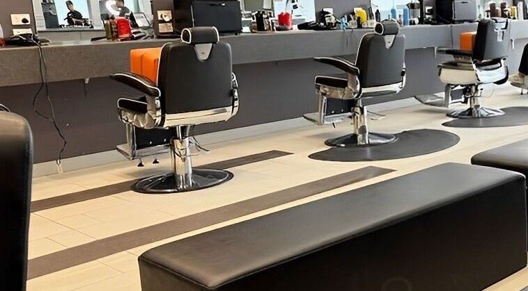 Modern salon chairs and mirrors at Goats Cuts, Southport, Queensland, AU, offering a stylish ambiance.