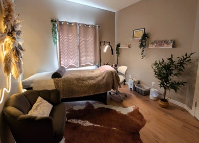 Relaxing treatment room at Country Lashes in Warburg, Alberta, CA with cozy decor and soft lighting.