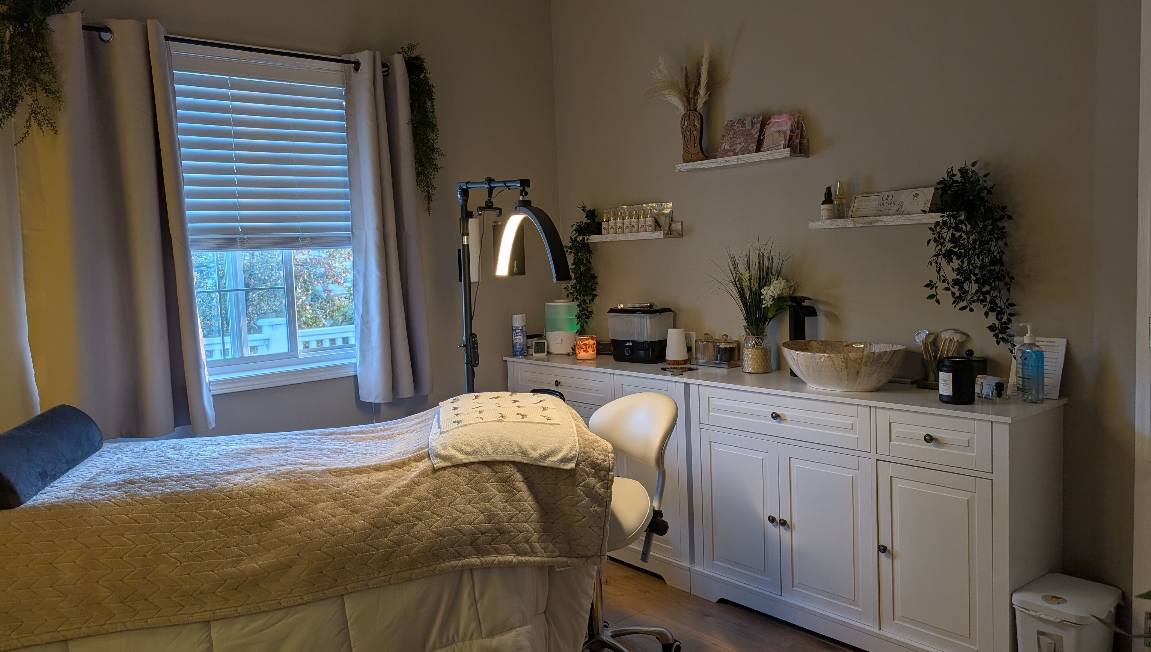 Cozy treatment room at Country Lashes in Warburg, Alberta, CA featuring a comfortable bed and soothing decor.