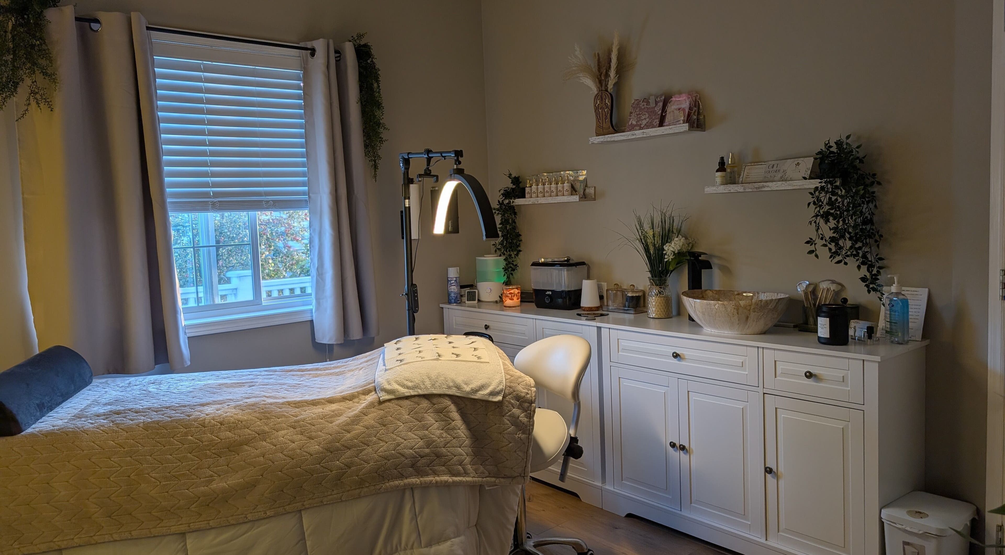 Cozy treatment room at Country Lashes in Warburg, Alberta, CA featuring a comfortable bed and soothing decor.