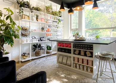 Bright and modern Esthetic Society wellness space in Bellevue, Washington, US with natural decor and products on display.