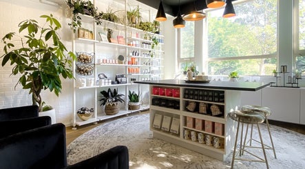 Bright and modern Esthetic Society wellness space in Bellevue, Washington, US with natural decor and products on display.