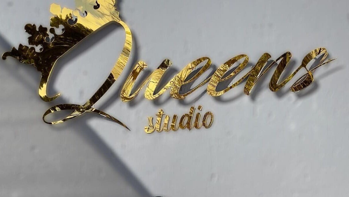 Queens Studio SA golden sign in Fourways, Gauteng, ZA, showcasing elegance and luxury.