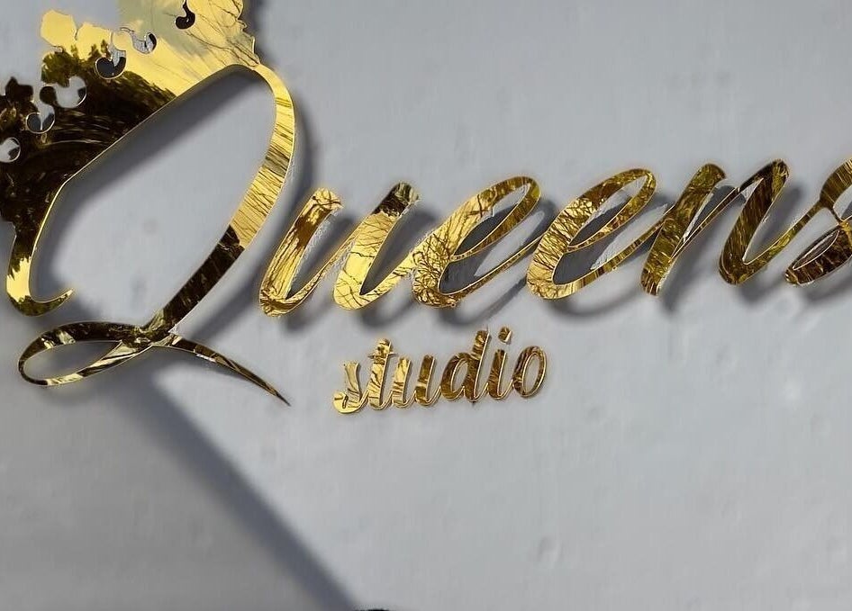 Queens Studio SA golden sign in Fourways, Gauteng, ZA, showcasing elegance and luxury.