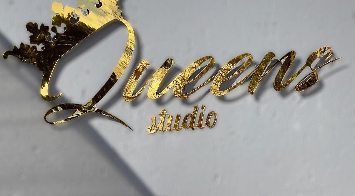 Queens Studio SA golden sign in Fourways, Gauteng, ZA, showcasing elegance and luxury.