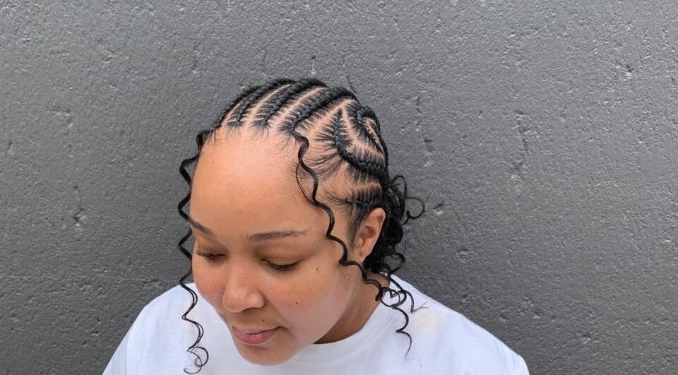 Stylish braided hairstyle at Queens Studio SA, Fourways, Gauteng, ZA. Showcasing detailed protective braids.