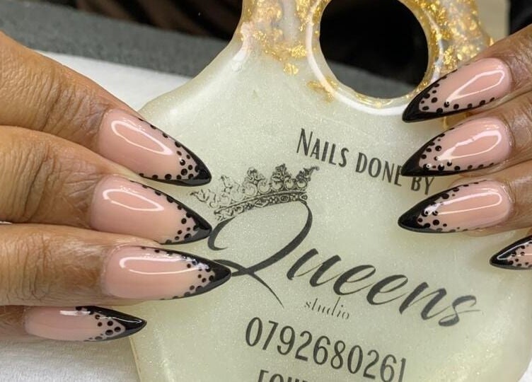 Stylish black-tipped nails at Queens Studio SA in Fourways, Gauteng, ZA, showcasing intricate design.