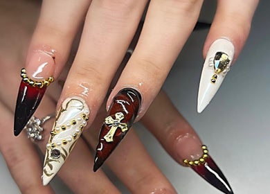 Intricate gothic nail art at Sweet&SinfulBeauty, Tamworth, New South Wales, AU with gold accents and dark hues.