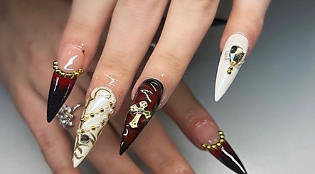 Intricate gothic nail art at Sweet&SinfulBeauty, Tamworth, New South Wales, AU with gold accents and dark hues.