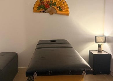 Relaxing massage room at Statera Massage Studio, Cape Town, Western Cape, ZA, featuring a cozy ambiance.