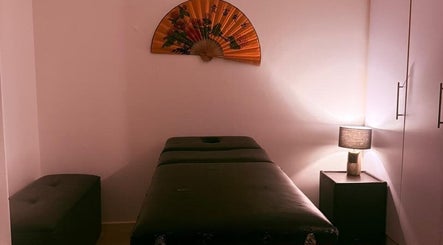 Tranquil massage room at Statera Massage Studio, Cape Town, Western Cape, ZA with soft lighting and decor.
