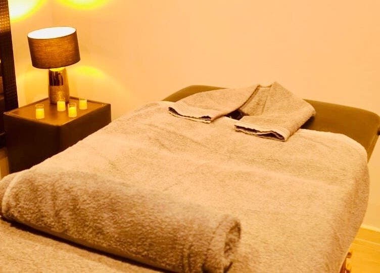 Tranquil massage room at Statera Massage Studio, Cape Town, Western Cape, ZA, with cozy towel setup.