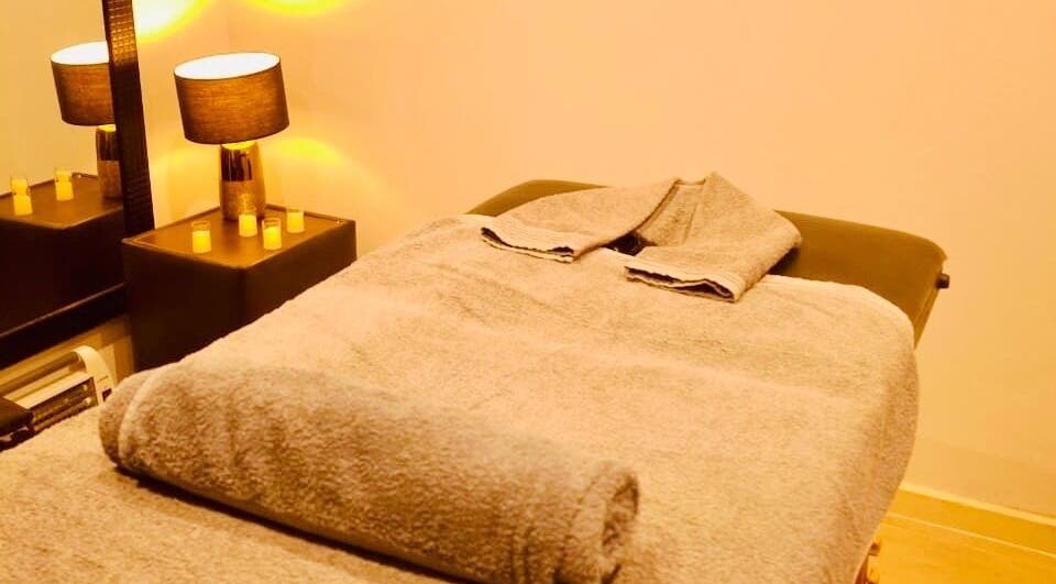 Tranquil massage room at Statera Massage Studio, Cape Town, Western Cape, ZA, with cozy towel setup.