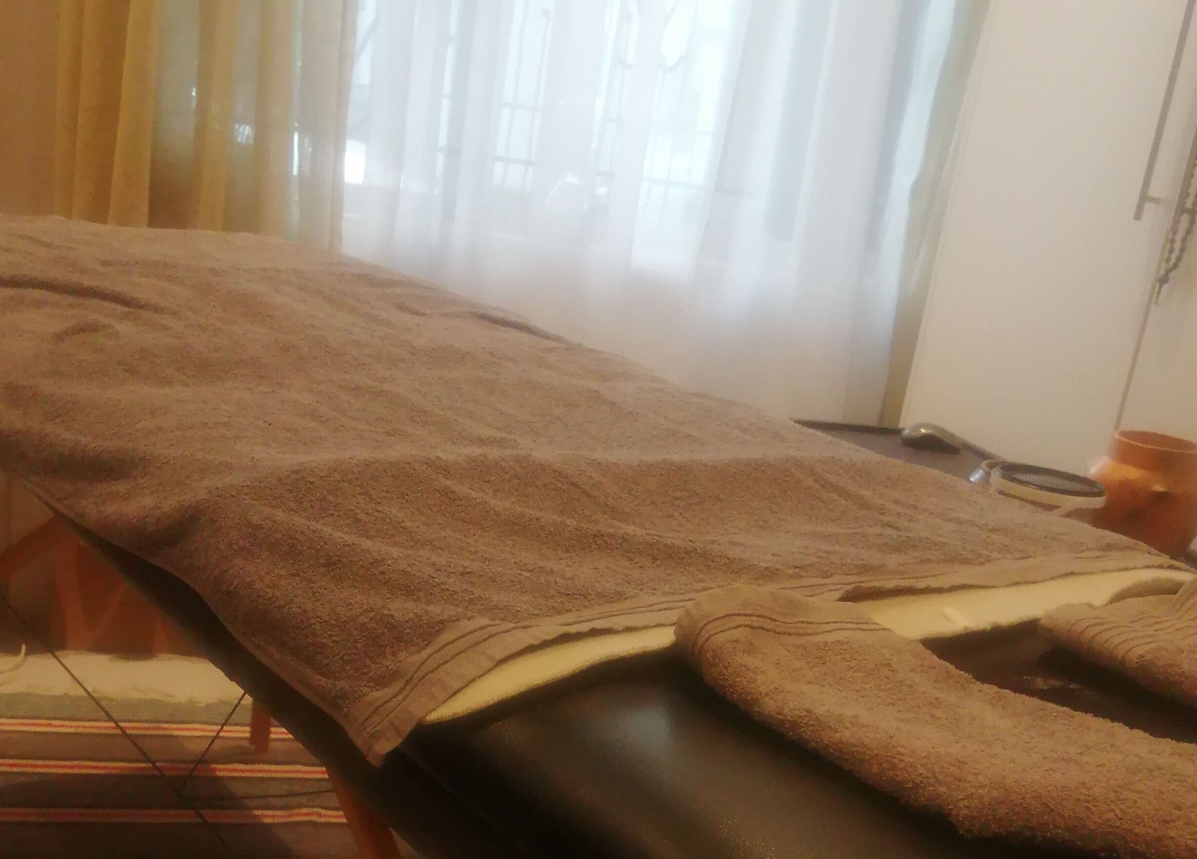 Cozy massage table at Statera Massage Studio, Cape Town, Western Cape, ZA, ready for relaxation.