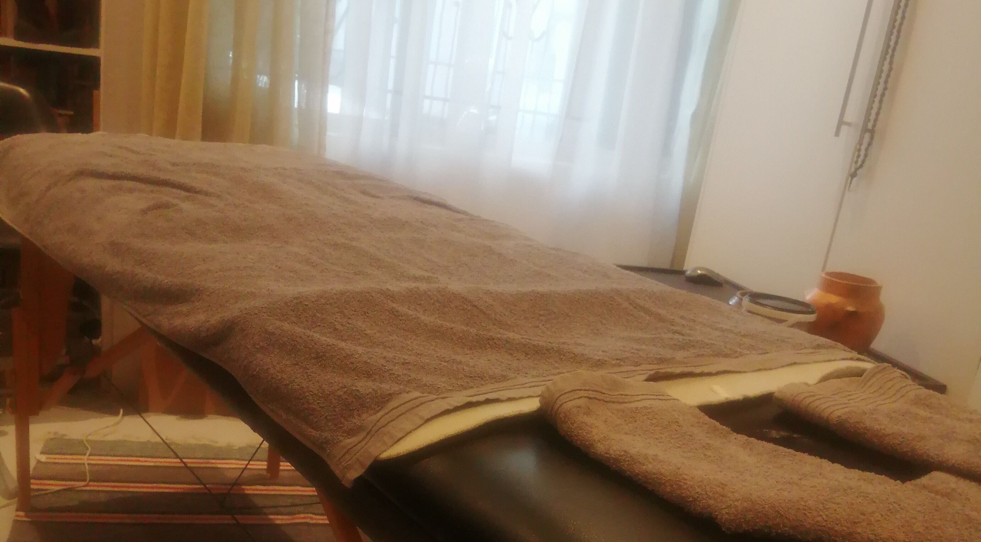Cozy massage table at Statera Massage Studio, Cape Town, Western Cape, ZA, ready for relaxation.